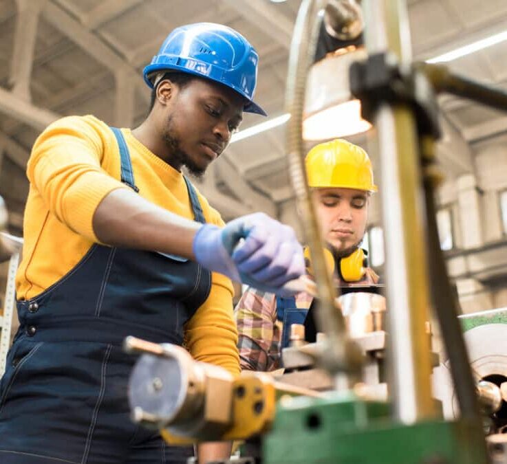 Manufacturing workers operating machinery